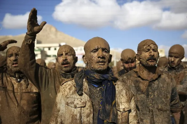 Iranian Shiites cover themselves with mud during Ashoura, marking the death anniversary of Imam Hussein, the grandson of Islam's Prophet Muhammad, at the city of Bijar, west of the capital Tehran, Iran, Thursday, November 14, 2013. (Photo by Ebrahim Noroozi/AP Photo)