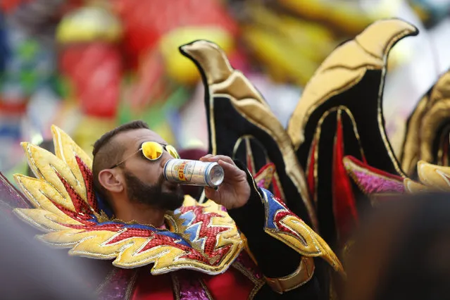 A carnival dancer drinks beer during carnival festivities in Valletta, Malta, February 7, 2016. (Photo by Darrin Zammit Lupi/Reuters)