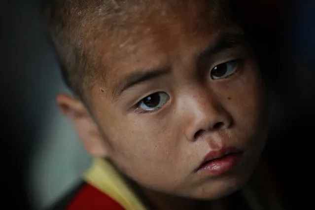 A North Korean child waits to be examined for possible signs of malnutrition in an orphanage in an area damaged by summer floods and typhoons in South Hwanghae province, October 1, 2011. (Photo by Damir Sagolj/Reuters)