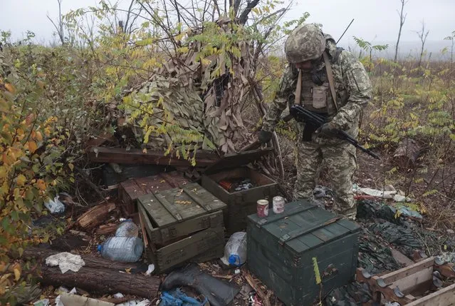 A Ukrainian serviceman of the 65th separate mechanized brigade inspects the former position of Russian troops, now named as “X” position, near Robotyne village of Zaporizhzhia area, Ukraine, 04 November 2023, amid the Russian invasion. The “X” position is the key height to the exit to Robotyne, which is located a few kilometers from this village. In June 2023, the fighters of the 65th SMBr captured these positions, which allowed the Ukrainian units to advance in the direction of the village of Robotyne and liberate the settlement. Russian troops entered Ukrainian territory in February 2022, starting a conflict that has provoked destruction and a humanitarian crisis. (Photo by Kateryna Klochko/EPA/EFE)