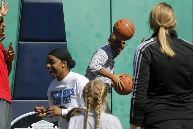 U.S. President Barack Obama gets hit on the head by a rebound while playing basketball, an exercise activity during the annual Easter Egg Roll at the White House in Washington April 6, 2015. (Photo by Jonathan Ernst/Reuters)