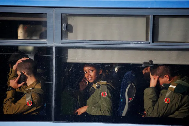 Israeli soldiers sit in a bus as they leave the scene of a truck-ramming incident in Jerusalem January 8, 2017. (Photo by Ronen Zvulun/Reuters)