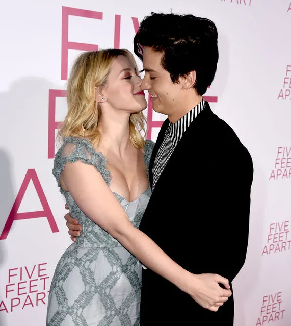 Lili Reinhart (L) and Cole Sprouse arrive at the premiere of CBS Films' “Five Feet Apart” at the Fox Bruin Theatre on March 07, 2019 in Los Angeles, California. (Photo by Kevin Winter/Getty Images)