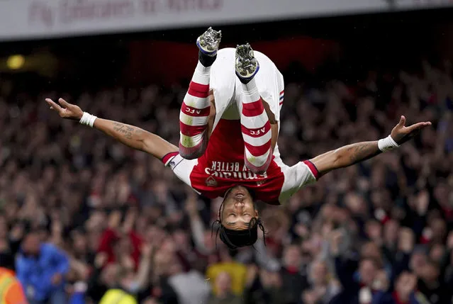 Arsenal's Pierre-Emerick Aubameyang celebrates after scoring the opening goal during the English Premier League soccer match between Arsenal and Crystal Palace at the Emirates Stadium in London, England, Monday October 18, 2021. (Photo by Adam Davy/PA Wire via AP Photo)