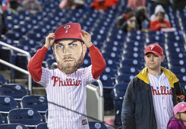 A Philadelphia Phillies fan wears a Bryce Harper (3) mask prior to action against the Washington Nationals at Nationals Park on April 2, 2019. (Photo by Jonathan Newton/The Washington Post)