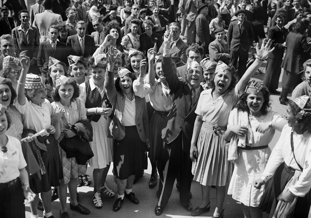 Picture dated of May 8, 1945 showing young girls celebrating the unconditionnal German capitulation in the streets of Paris, at the end of the second World War. (Photo by AFP/Getty Images)