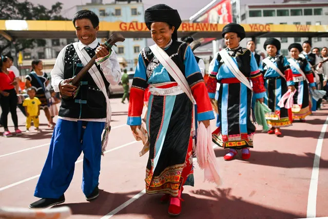 People wearing traditional outfits participate in a rehearsal in Panghsang on April 15, 2019, ahead of a military parade to celebrate 30 years of a ceasefire signed with the Myanmar military. (Photo by Ye Aung Thu/AFP Photo)