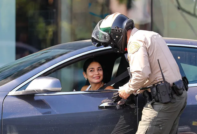 Actress Vanessa Hudgens starts her week off with a ticket for using her phone while driving in West Hollywood, CA. on August 30, 2021 The actress seems to try to charm her way out of the violation with a smile but has no luck. (Photo by Backgrid USA)