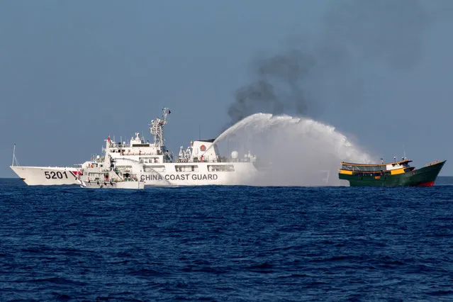 Chinese Coast Guard vessels fire water cannons towards a Philippine resupply vessel Unaizah May 4 on its way to a resupply mission at Second Thomas Shoal in the South China Sea, on March 5, 2024. (Photo by Adrian Portugal/Reuters)