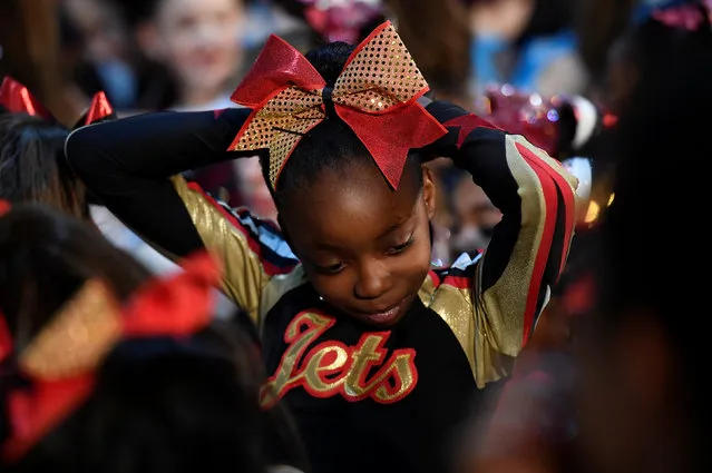 Competitors react during an awards ceremony at the Legacy Super Regional Cheer and Dance Championships at Copperbox Arena, Queen Elizabeth Olympic Park in London, Britain, February 19, 2017. (Photo by Toby Melville/Reuters)