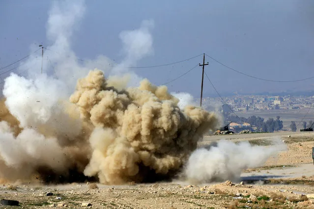 Smoke rises after an explosion of an IED planted by Islamic States fighters in south of Mosul, Iraq February 20, 2017. (Photo by Alaa Al-Marjani/Reuters)