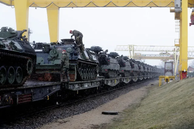 German army soldiers prepare to unload Marder infantry fighting vehicles at the railway station in Sestokai, Lithuania, February 24, 2017. (Photo by Ints Kalnins/Reuters)