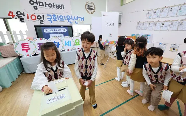 Children participate in a mock vote at a kindergarten in Incheon, South Korea, 12 March 2024. The event was arranged by the local election management commission ahead of the 10 April parliamentary elections. (Photo by Yonhap/EPA)