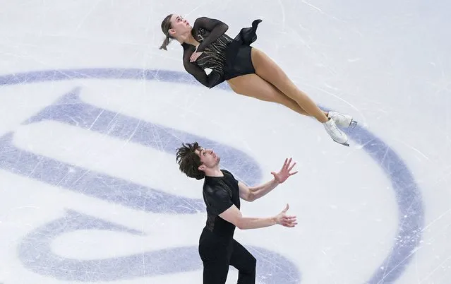 Kelly Ann Laurin and Loucas Ethier, of Canada, perform their pairs short program during the 2024 ISU World Figure Skating Championships in Montreal, Wednesday, March 20, 2024. (Photo by Graham Hughes/The Canadian Press via AP Photo)
