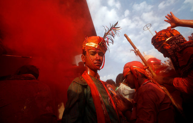 Hindu devotees take part in Holi in Nandgaon village, in the state of Uttar Pradesh, India, March 7, 2017. (Photo by Adnan Abidi/Reuters)