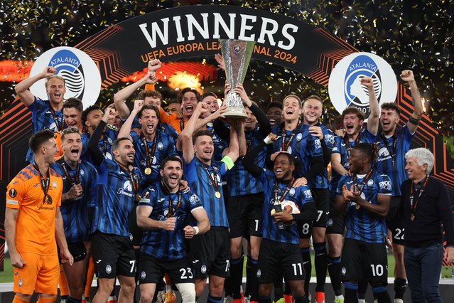 Berat Djimsiti of Atalanta BC lifts the UEFA Europa League Trophy with teammates after their team's victory during the UEFA Europa League 2023/24 final match between Atalanta BC and Bayer 04 Leverkusen at Dublin Arena on May 22, 2024 in Dublin, Ireland. (Photo by Alex Grimm/Getty Images)