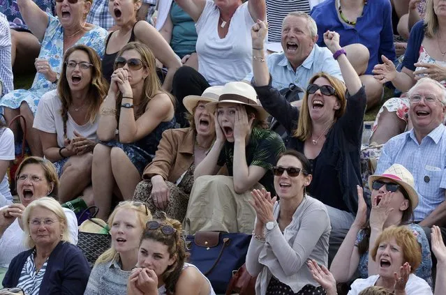 Fans react on 'Murray Mound' to the match between Heather Watson of Britain and Serena Williams of the U.S.A. at the Wimbledon Tennis Championships in London, July 3, 2015. (Photo by Toby Melville/Reuters)
