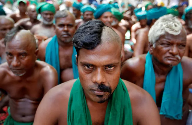 Farmers from the southern state of Tamil Nadu pose half shaved during a protest demanding a drought-relief package from the federal government, in New Delhi, India April 3, 2017. (Photo by Cathal McNaughton/Reuters)