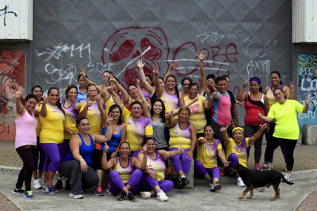 The participants of an aerobics class poses for a picture in the Los Guidos de Desamparados July 23, 2015. (Photo by Juan Carlos Ulate/Reuters)
