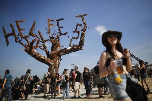 Festival-goers attend the Hellfest music Festival in Clisson, western France, June 20, 2014. (Photo by Stephane Mahe/Reuters)