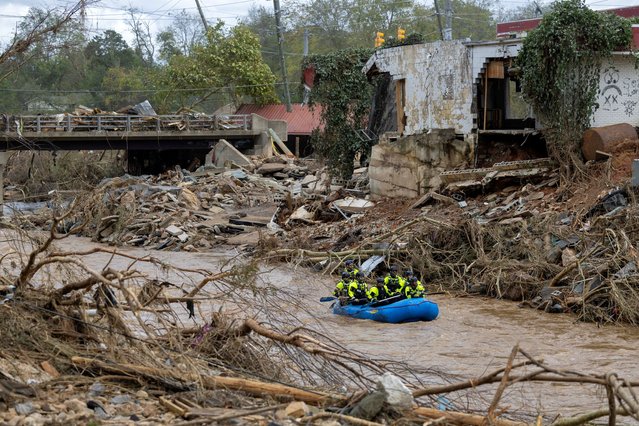 A rescue team paddles down the Swannanoa River after the remnants of Hurricane Helene caused widespread flooding, downed trees, and power outages in western North Carolina, September 29, 2024.  (Photo by Travis Long/The News & Observer)