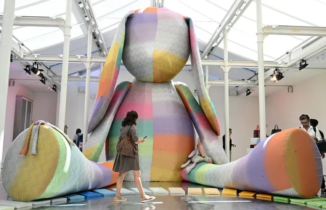 People look at exhibits as they visit the Missoni installation presented at the Fuori Salone Milan Design Week, in Milan, Italy, 10 June 2022. The Fuori Salone runs from 06 to 13 June. (Photo by Daniel Dal Zennaro/EPA/EFE)