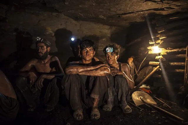 Miners pose for a photograph at the coal face inside a mine in Choa Saidan Shah, Punjab province, April 29, 2014. (Photo by Sara Farid/Reuters)