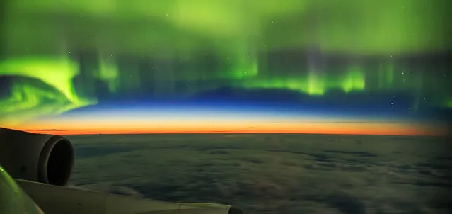 “Aurorae”. Highly commended: Aurora Shot from Plane by Ye Ziyi (China) The vivid green aurora swirls over the deep, blue sky and the orange glow of twilight as seen from the window of a plane travelling from Amsterdam to Beijing. The photographer had been expecting an auroral outburst to occur during the flight, so paid for the seat that was best for observing. As well as the strong auroral activity, the photographer was also blessed with a white night making twilight visible on the horizon. Novosbirsk, Russia, 24 August 2016 Canon EOS 6D camera, 20 mm f/1.8 lens, ISO 2000, 3-second exposure. (Photo by Ye Ziyi/Insight Astronomy Photographer of the Year 2017)