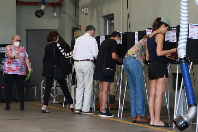 Voters cast their ballots at a polling station setup in a fire station on August 23, 2022 in Miami Beach, Florida. Voters across the state cast their ballots during the Florida Primary Elections. (Photo by Joe Raedle/Getty Images)