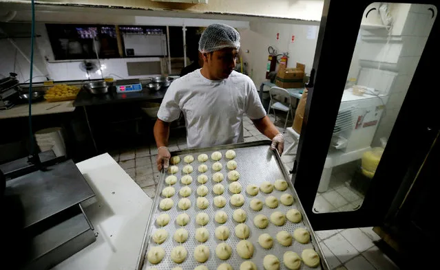 A worker prepares pao de queijo (cheese bread) at the Cultivar cafe and store in Santa Teresa neighbourhood in Rio de Janeiro, Brazil, July 28, 2016. (Photo by Sergio Moraes/Reuters)