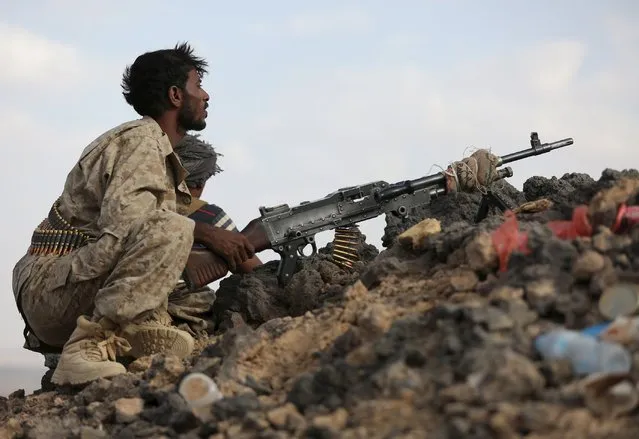 A soldier loyal to Yemen's exiled government takes up a position during fighting with Houthi militia in Yemen's central province of Marib September 13, 2015. Yemen's exiled government pulled out of U.N.-mediated peace talks with its Houthi adversaries on Sunday as troops from the Saudi-led coalition that is seeking to restore it took part in ground fighting in Marib for the first time. (Photo by Reuters/Stringer)
