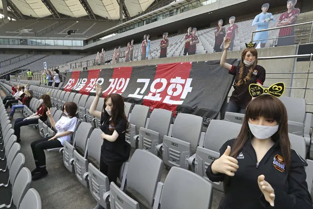 In this May 17, 2020, photo, cheering mannequins are installed at the empty spectators' seats before the start of a soccer match between FC Seoul and Gwangju FC at the Seoul World Cup Stadium in Seoul, South Korea. A South Korean professional soccer club has apologized after being accused of putting s*x dolls in empty stands during a match Sunday in Seoul. In a statement, FC Seoul expressed “sincere remorse” over the controversy, but insisted that it used mannequins, not s*x dolls, to mimic a home crowd during its 1-0 win over Gwangju FC at the Seoul World Cup stadium. (Photo by Ryu Young-suk/Yonhap via AP Photo)