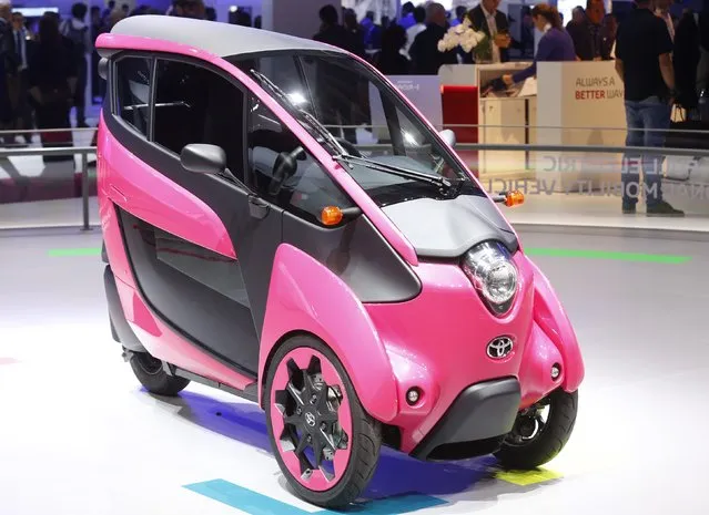 A three wheel design and ultra compact Toyota I-Road electric car is displayed on media day at the Paris Mondial de l'Automobile, October 2, 2014. The Paris auto show opens its doors to the public from October 4 to October 19. (Photo by Jacky Naegelen/Reuters)