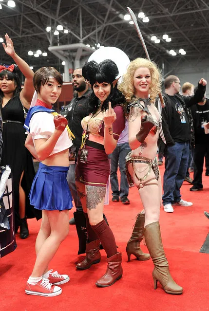 Comic Con attendees pose during the 2014 New York Comic Con at Jacob Javitz Center on October 9, 2014 in New York City. (Photo by Daniel Zuchnik/Getty Images)