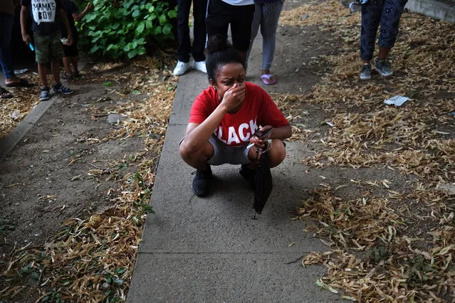 A woman who knew the victim cries at the scene of an afternoon shooting that left one person dead on July 07, 2020 in the Brooklyn borough of New York City. New York City has witnessed a surge in gun violence over the past month with 9 people killed, including children, and 41 others wounded on the Fourth of July weekend alone. The gun violence is occurring against the backdrop of a nationwide movement to consider defunding police departments. (Photo by Spencer Platt/Getty Images)