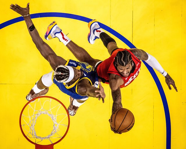 Golden State Warriors' Jimmy Butler (10) blocks a shot by Houston Rockets' Jalen Green (4) in the first half of an NBA basketball game in San Francisco, on Sunday, April 6, 2025. (Photo by Carlos Avila Gonzalez/San Francisco Chronicle via AP Photo)
