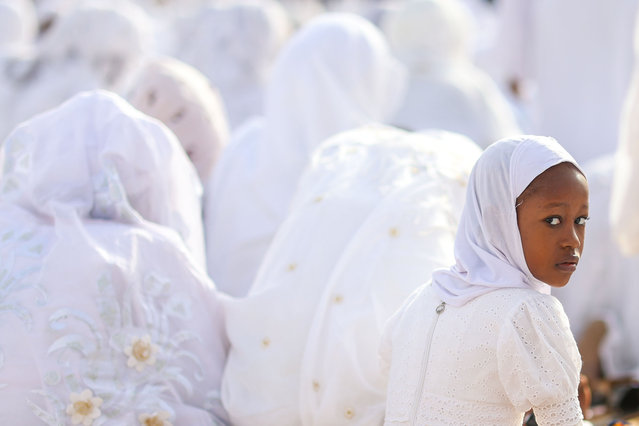 Followers of the Layene Sufi Order, dressed in white, gather to perform the Eid al-Fitr prayer at the beach surrounding the tomb of Seydina Limamou Lahi, the founder of the Layene Order, in the Yoff district of Dakar, Senegal on March 25, 2025. (Photo by Cem Ozdel/Anadolu via Getty Images)