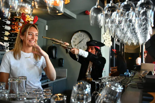 Allanah Malone laughs as “Captain Jack Sparrow” lookalike Ken Cusack plays around in Bubba’s restaurant during the recent annual Dalkey Lobster Festival in South County Dublin on August 27, 2022. (Photo by Michael Chester /The Irish Times)