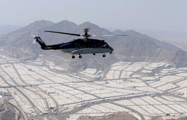 A Saudi security helcopter flies over the tents of Muslim pilgrims on the second day of Eid al-Adha in Mina, near the holy city of Mecca, during the annual haj pilgrimage September 13, 2016. (Photo by Ahmed Jadallah/Reuters)