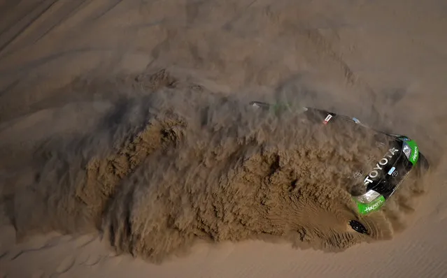 South Racing’s driver Sebastián Halpern and co-driver Edu Pulenta plough through the sand in their Toyota Hilux during the 2018 Dakar Rally Stage 5 between San Juan De Marcona and Arequipa in Peru, on January 10, 2018. (Photo by Franck Fife/AFP Photo)