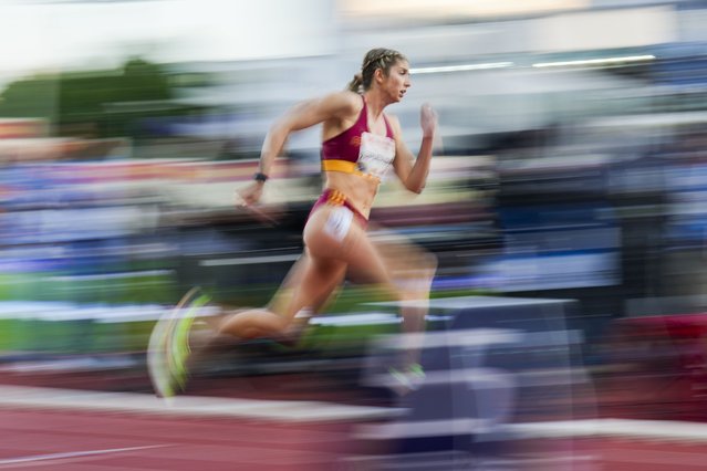 In this image taken with a slow shutter speed, Slovakia's Emma Zapletalová competes in the women's 400-meter hurdle race during the Bislett Games athletics meeting at Bislett Stadium in Oslo, Thursday, June 12, 2025. (Photo by Fredrik Varfjell/NTB via AP Photo)