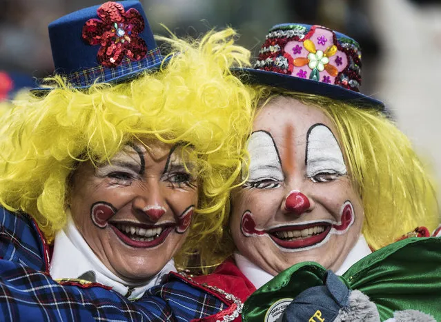 Disguised participants enjoy the carnival procession in Ludwigshafen, Germany Sunday, February 11, 2018. (Photo by Andreas Arnold/DPA via AP Photo)
