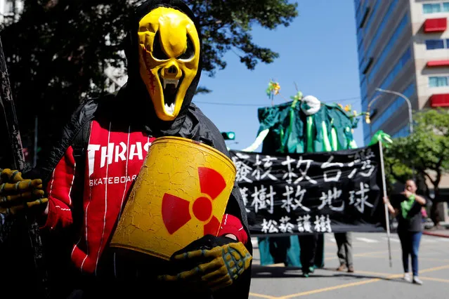 Demonstrators take part in a protest against nuclear power on the 7th anniversary of Japan's Fukushima nuclear disaster, in Taipei, Taiwan March 11, 2018. (Photo by Tyrone Siu/Reuters)