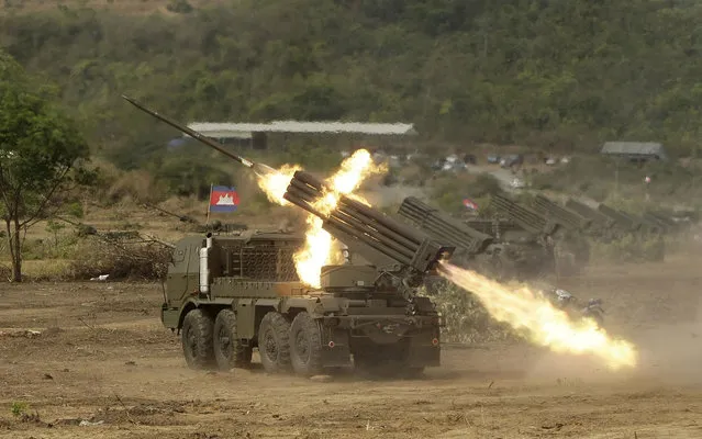 Cambodian army multiple rocket launchers are test fired at Phnom Sruoch complex of Cambodian army base, in Kampong Speu province, some 65 kilometers (40 miles) southwest of Phnom Penh, Cambodia Tuesday, April 2, 2013. About 107 rounds of Russian-made BM-21 rockets were fired, according to the army. (Photo by Heng Sinith/AP Photo)
