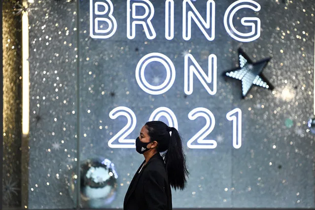 Members of the public walk past a window display at Harvey Nichols on November 11, 2020 in Edinburgh, Scotland. Retailers have warned of a retail and hospitality Christmas trade catastrophe, due to the Coronavirus restrictions which are jeopardising hundreds of jobs. (Photo by Jeff J. Mitchell/Getty Images)