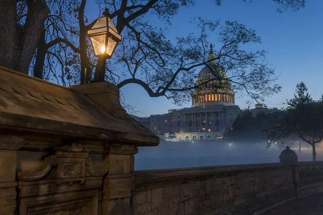 Fog blankets Capitol Hill in Washington, early Monday, November 9, 2020. The presidential race is over, but the future majority of the Senate could be determined by runoffs in Georgia. (Photo by J. Scott Applewhite/AP Photo)