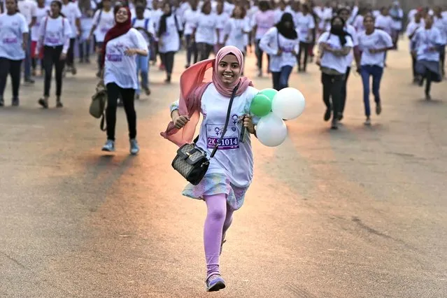 Students participate in a marathon ahead of the International Women's Day in Hyderabad, India, Monday, March 6, 2023. The theme of the marathon was “rise and Run” and was organized by the city police. (Photo by Mahesh Kumar A./AP Photo)