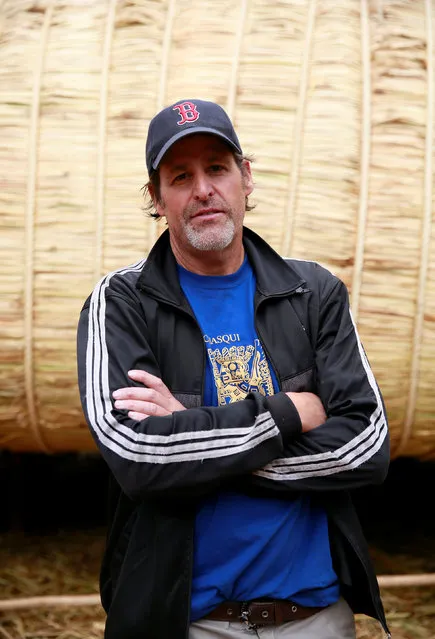Phil Buck, a 51-year-old explorer from the United States, poses for a picture in front of the “Viracocha III”, a boat made only from the totora reed, which he will captain on a journey expected to last six months, crossing the Pacific from Chile to Australia, in La Paz, Bolivia, October 19, 2016. (Photo by David Mercado/Reuters)