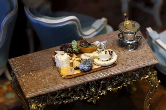A miniature plate of cheese is shown in the "formal living room" of the Astolat Castle, a 3 metre (9 foot) tall dollhouse, currently on display in New York November 14, 2015. (Photo by Lucas Jackson/Reuters)