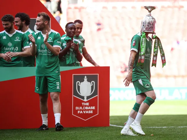 Goal scorer Kieran Barnes of Newport Pagnell Town with the trophy on his head as their team wins the FA Vase by beating Littlehampton Town 3-0 during the Buildbase FA Vase Final between Littlehampton Town and Newport Pagnell Town at Wembley Stadium on May 22, 2022 in London, England. (Photo by Eddie Keogh – The FA/The FA via Getty Images)